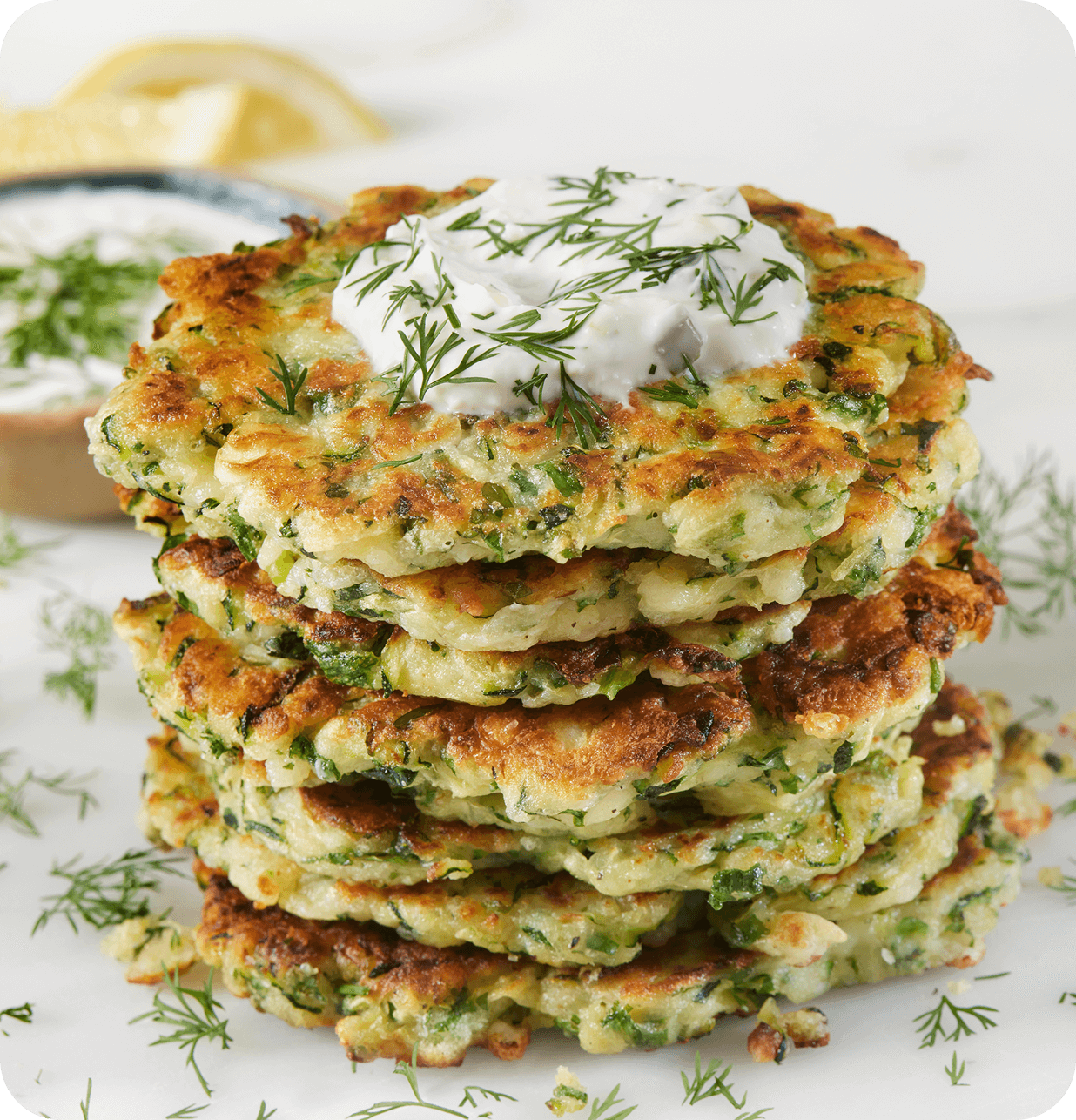 Crispy zucchini fritters with yogurt topping